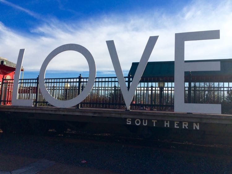 Take a romantic photo at the LOVE sign in Manassas Virginia