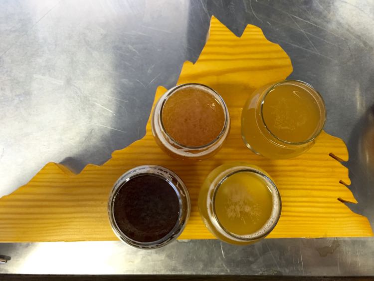 A flight of beer in a Virginia-shaped board highlights Northern Virginia Craft Beer and Breweries.