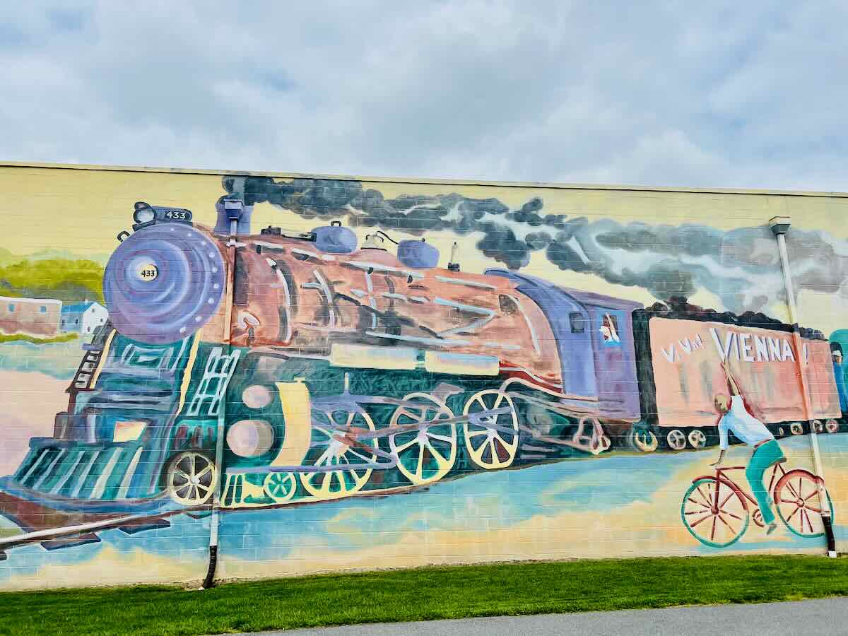 A downtown mural celebrates small town railroad history, one of the best things to do in Vienna Virginia