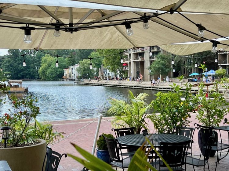 Dining tables with a lake view at Kalypsos one of the popular local Reston restaurants at Lake Anne.