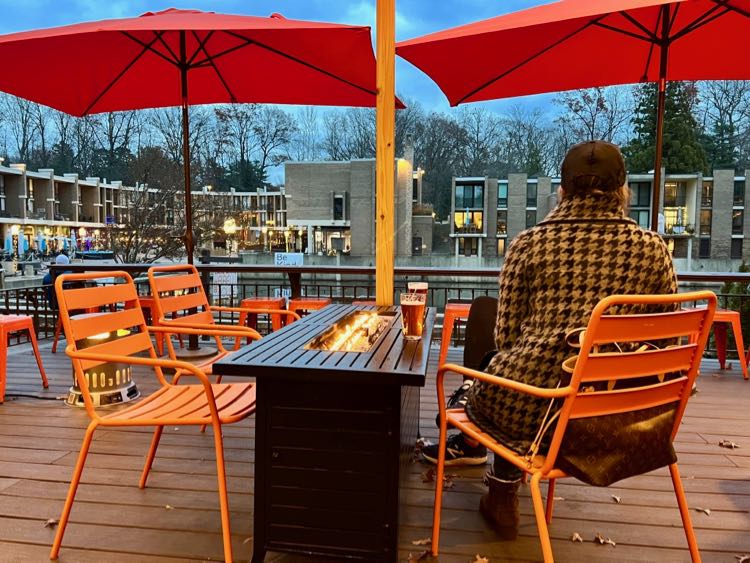 Stay warm in winter on the Lake Anne Brew House deck with heaters and a fire table in Reston VA.