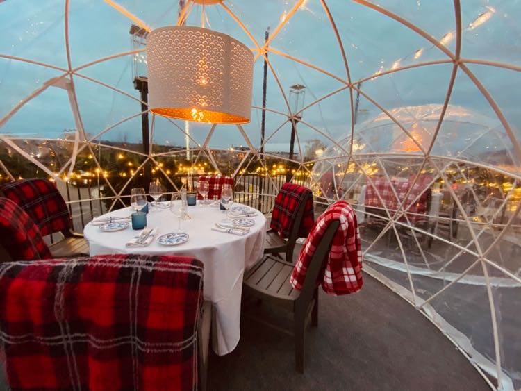 Heated outdoor dining and drinking igloo, photo by Farm Brew Live