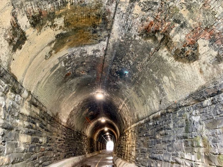 Walking through the Wilkes Street Tunnel, one of the cool things to do in Alexandria VA