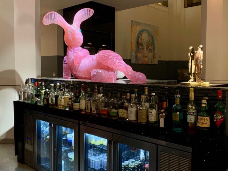 A big pink bunny lounging on the bar at the Glass Light hotel in Norfolk VA.