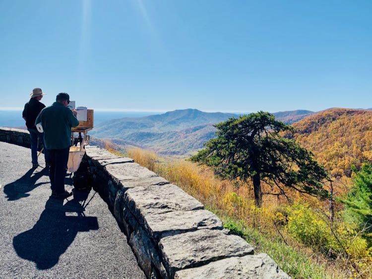 Painters capture fall foliage at the Pinnacles Overlook in Shenandoah National Park Virginia.