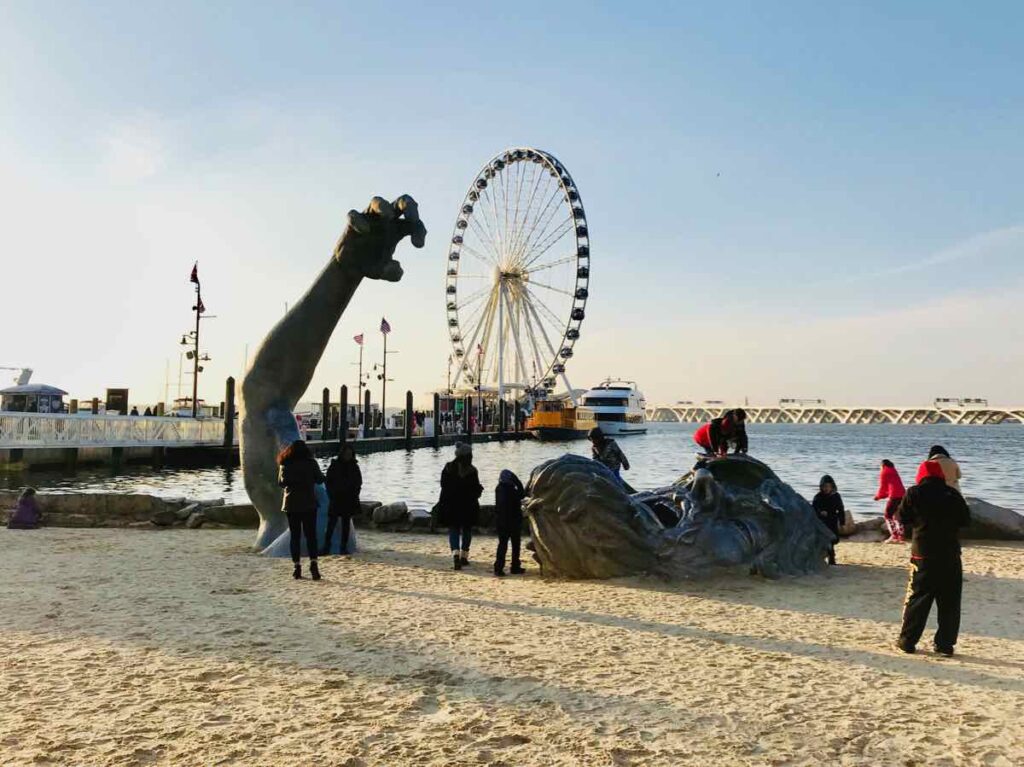 The Awakening sculpture and Capital Wheel, two of the fun things to do on a winter getaway to National Harbor Maryland
