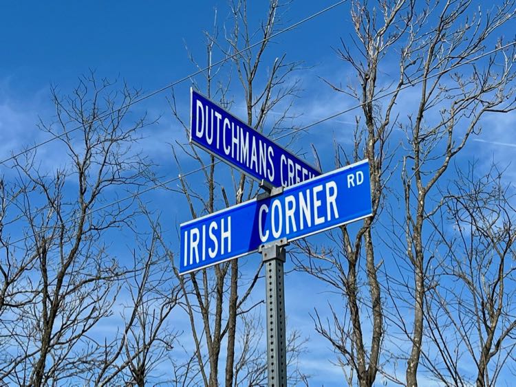 Street sign at the intersection of Dutchmans Creek and Irish Corner in Loudoun County VA