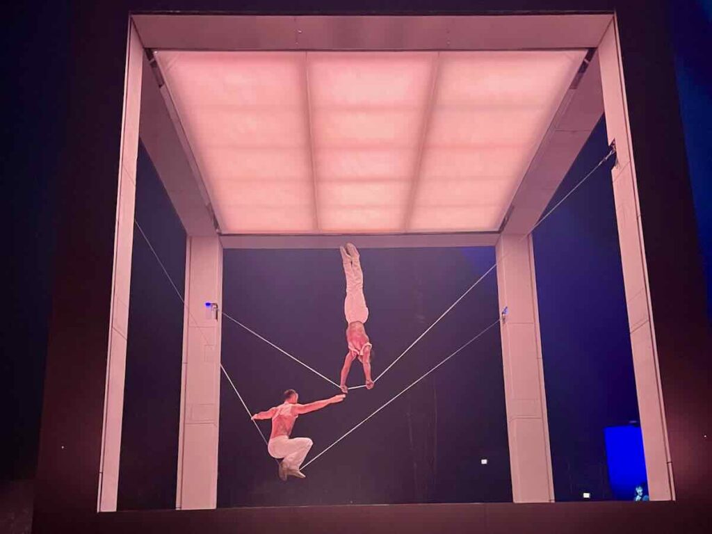 Cirque du Soleil Tysons Slackwire Act performs inside a giant cube