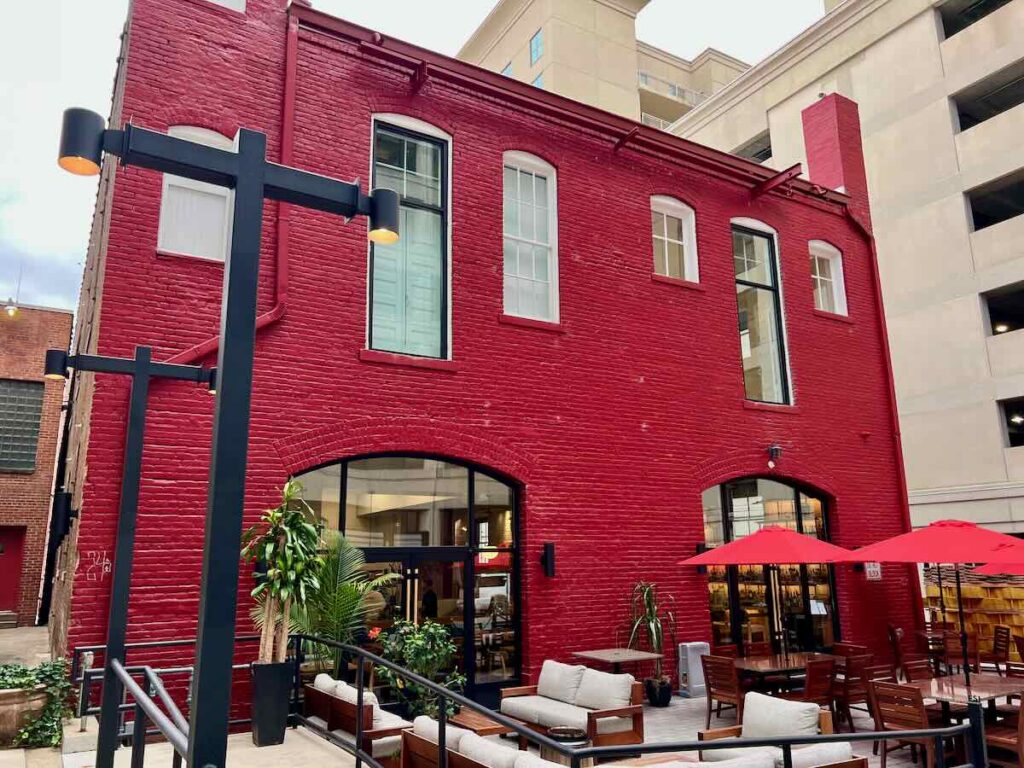 Outdoor Seating at Stock Restaurant, and the rear of the historic Fire Station One hotel building